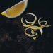 slice of lemon on black surface