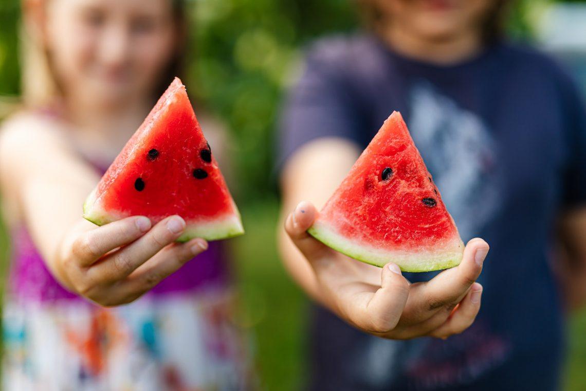 People Holding Watermelon Slices